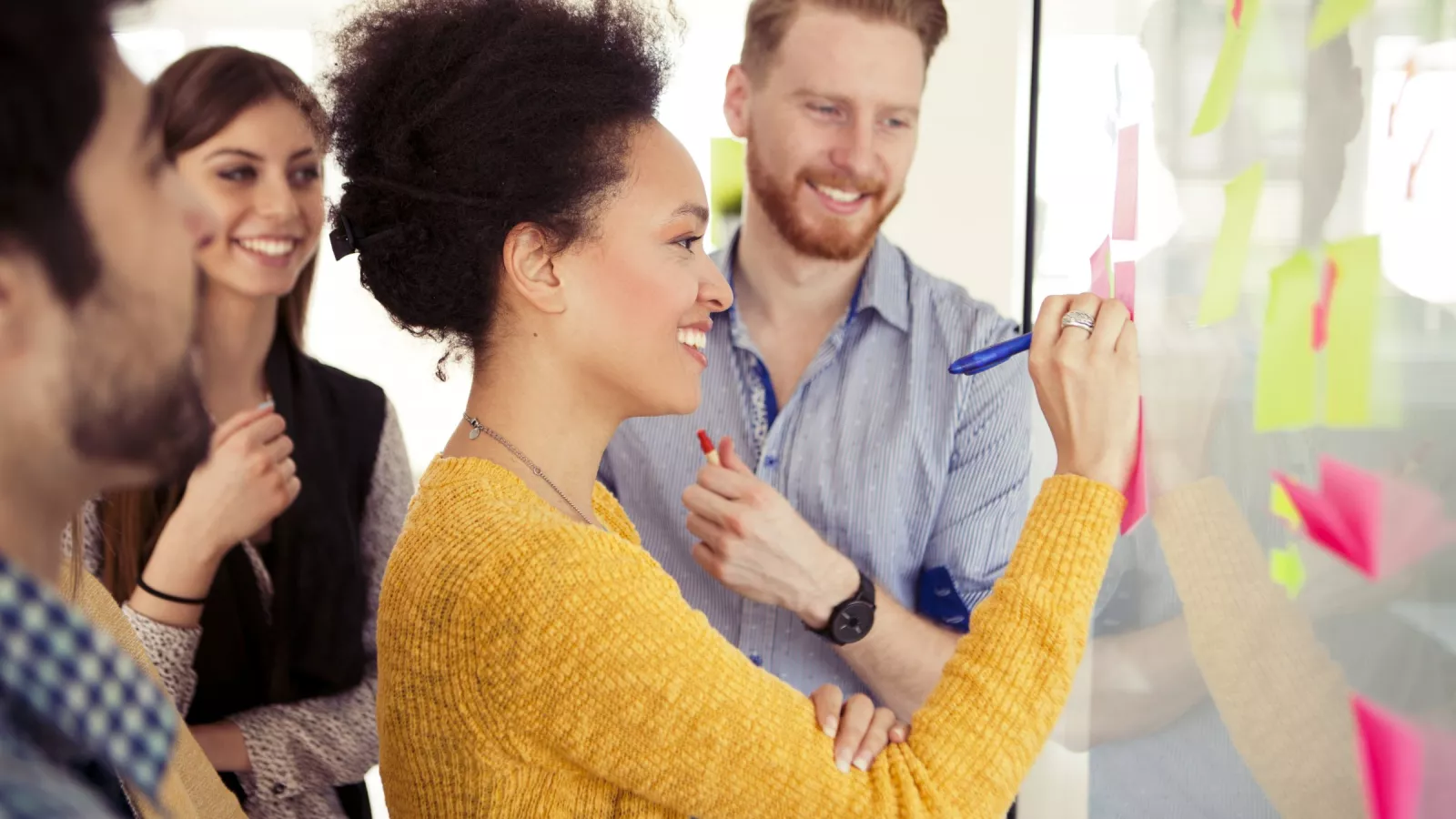 Educators work on a chart at a workshop.
