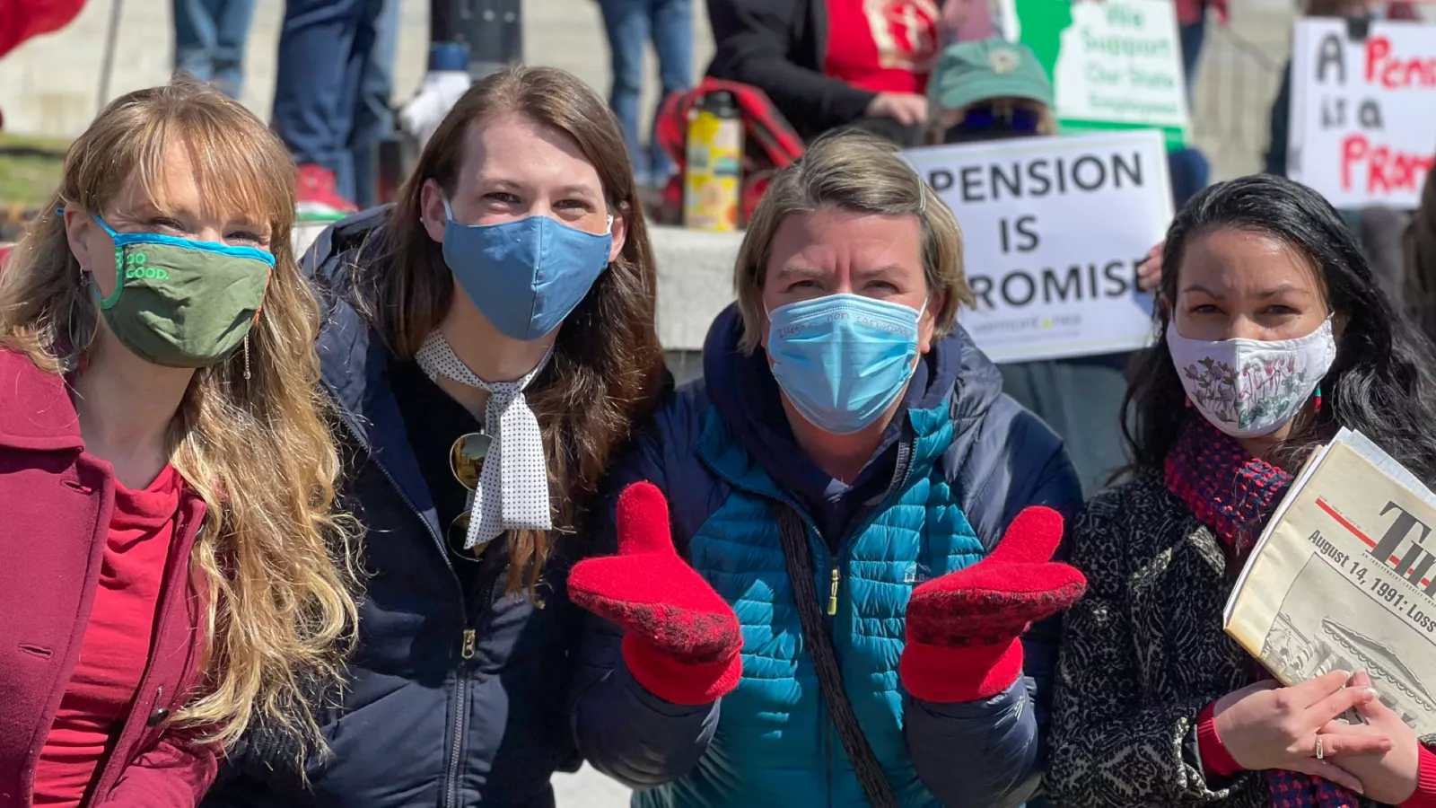 A few VT-NEA members stand together at a rally.