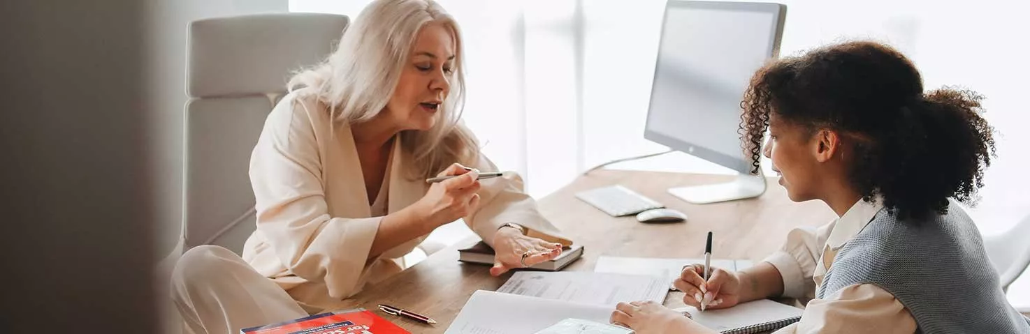 A retired educator mentors a new educator.