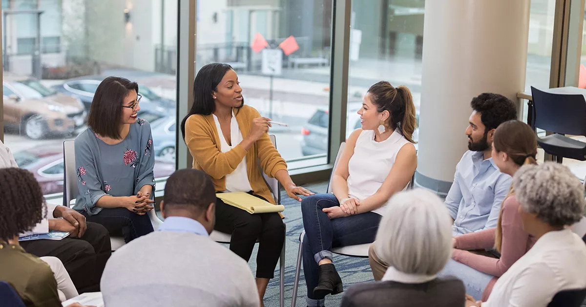 photos of educators in a circle collaborating in a meeting