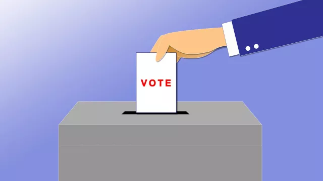 illustration of a hand putting a ballot in a box