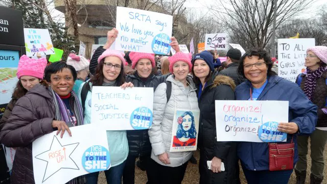 NEA officers participate in a march for gender equality